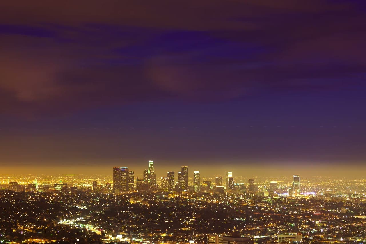 Los Angeles lit up at dusk, seen from the hills